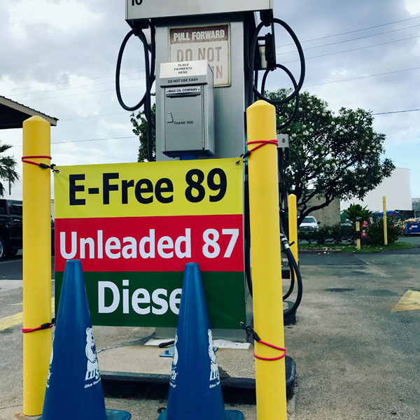 A sign at the fuel station featuring ethanol free, unleased, and diesel.