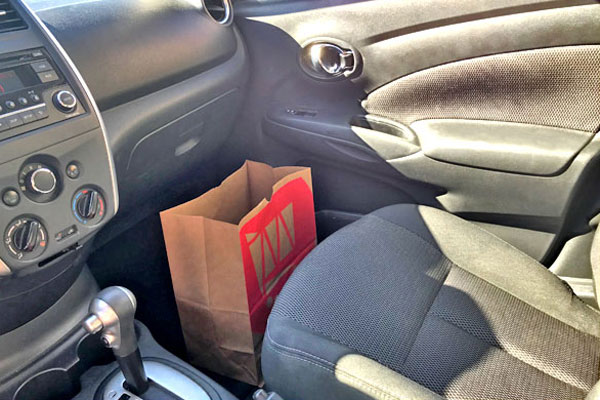 A paper bag is a cheap and easy way to manage your car's rubbish.